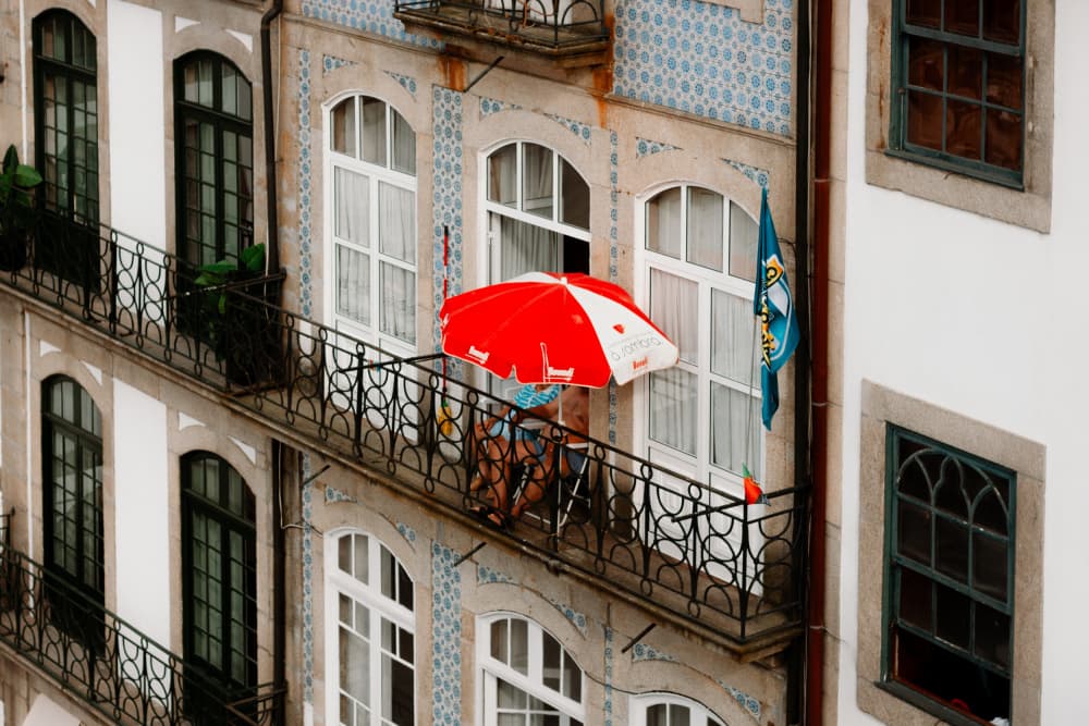 Balcony with Red Umbrella by Aimee Giles — canvas wall art