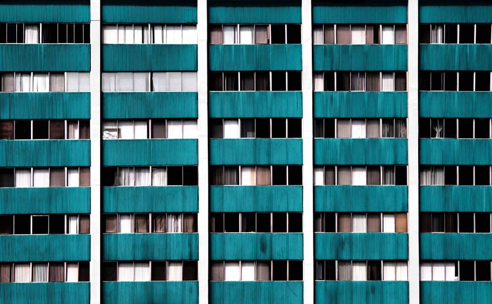 Teal Building Waving Hand by Roxana Labagnara — canvas wall art