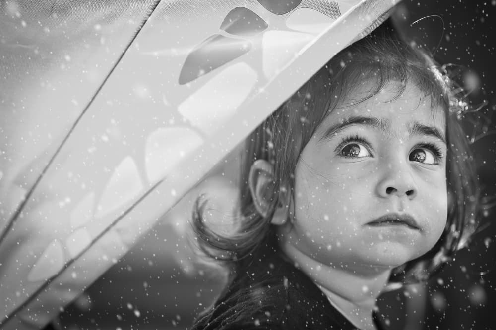 Curious Girl Under Snow by Carmit Rozenzvig — canvas wall art