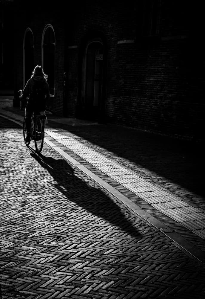 Lone Cyclist Long Shadow by Kelemen Sándor — canvas wall art