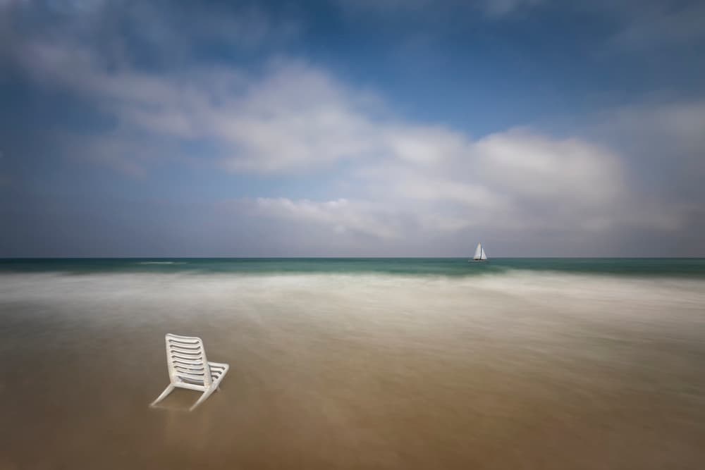Solitary Beach Chair by Azriel Yakubovitch — canvas wall art