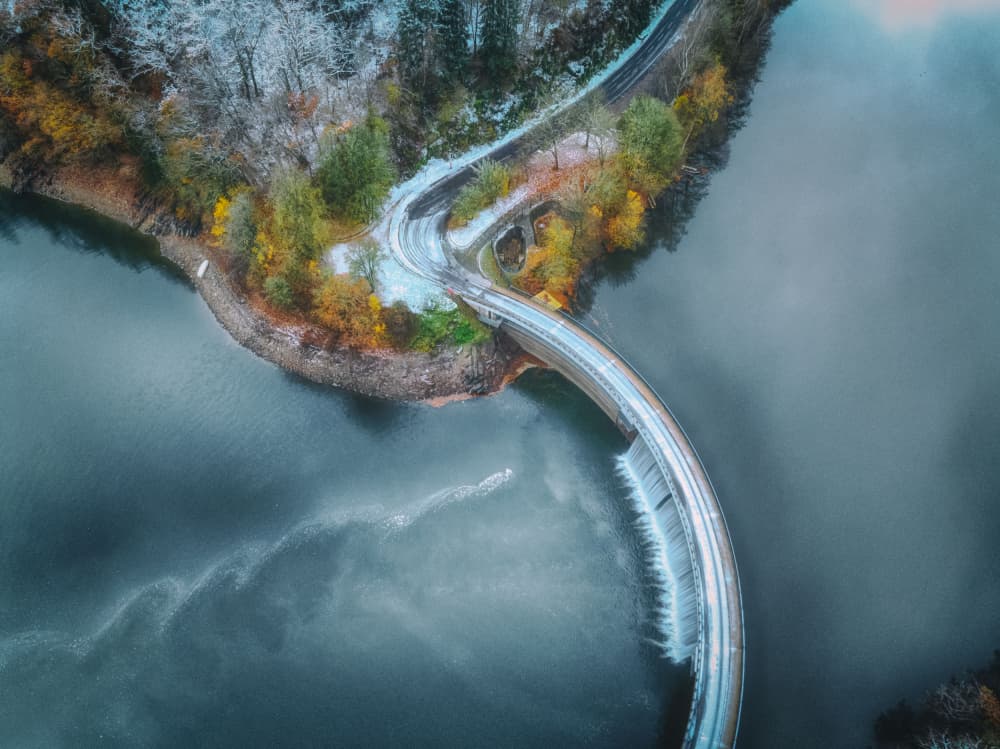 Snowy Autumn Dam Curve by Guy Krier — canvas wall art