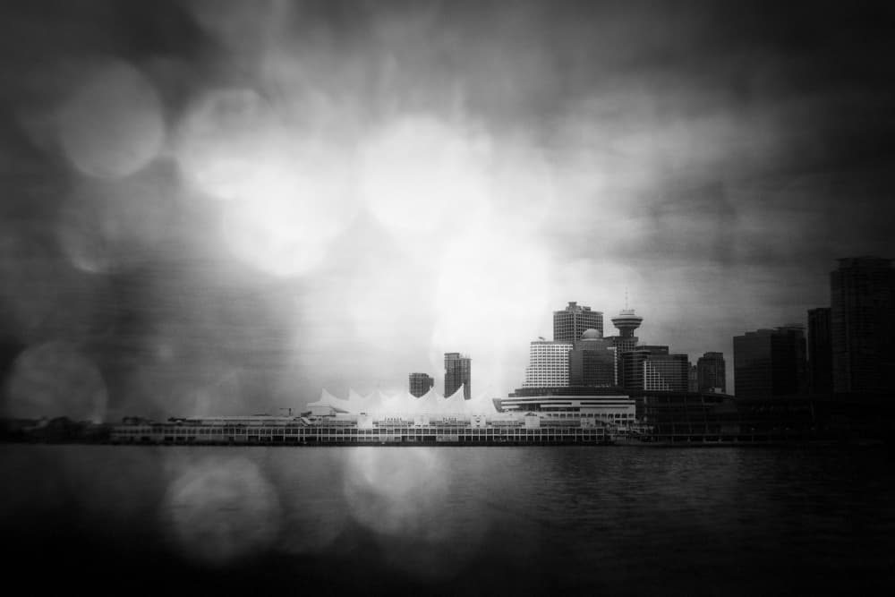 Moody Waterfront Skyline by Lynann Colligan — canvas wall art