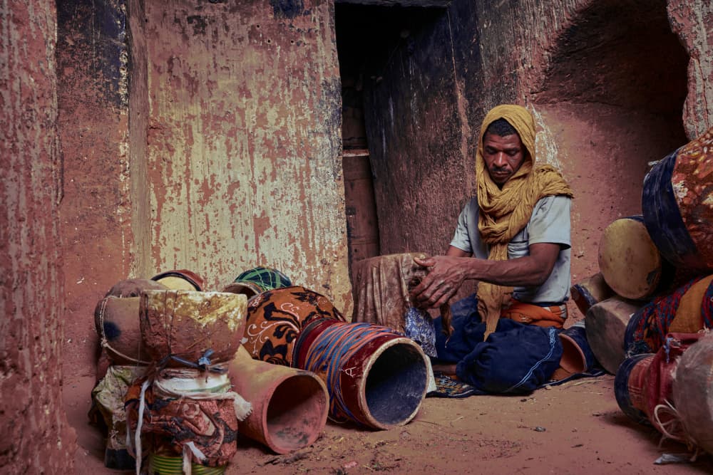Artisan Making Drums by ABDALLAH KHALILI — canvas wall art