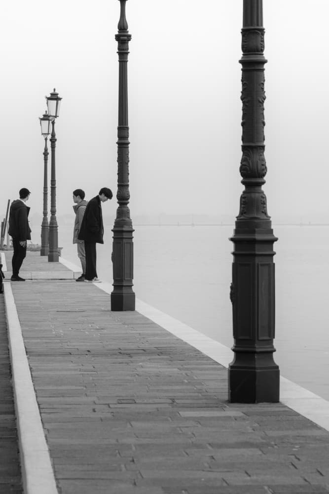 Men on Misty Pier by Alin Federiga — canvas wall art