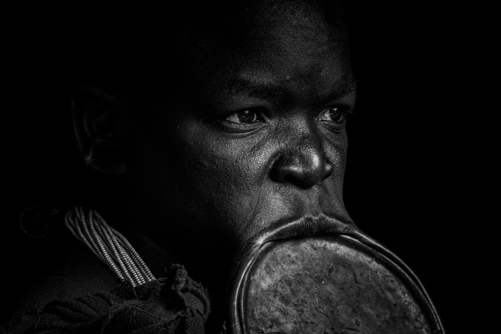 African Lip Plate Portrait by ADIREK M — canvas wall art