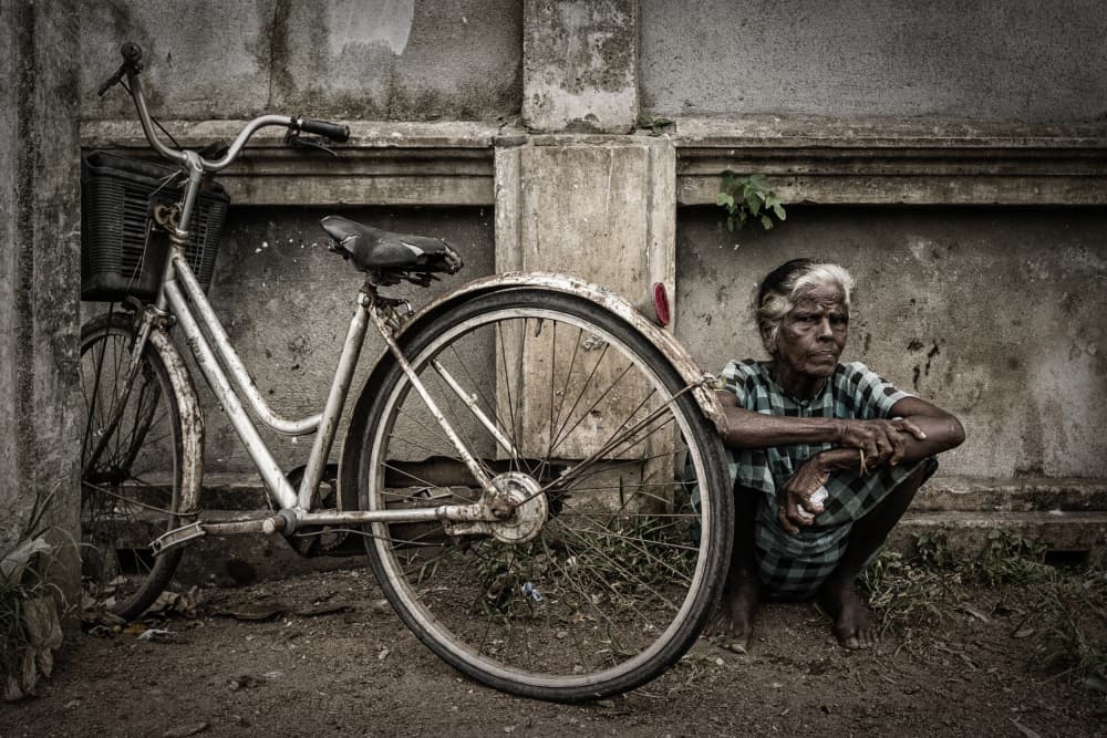 Old Woman And Bicycle by Pavol Stranak — canvas wall art
