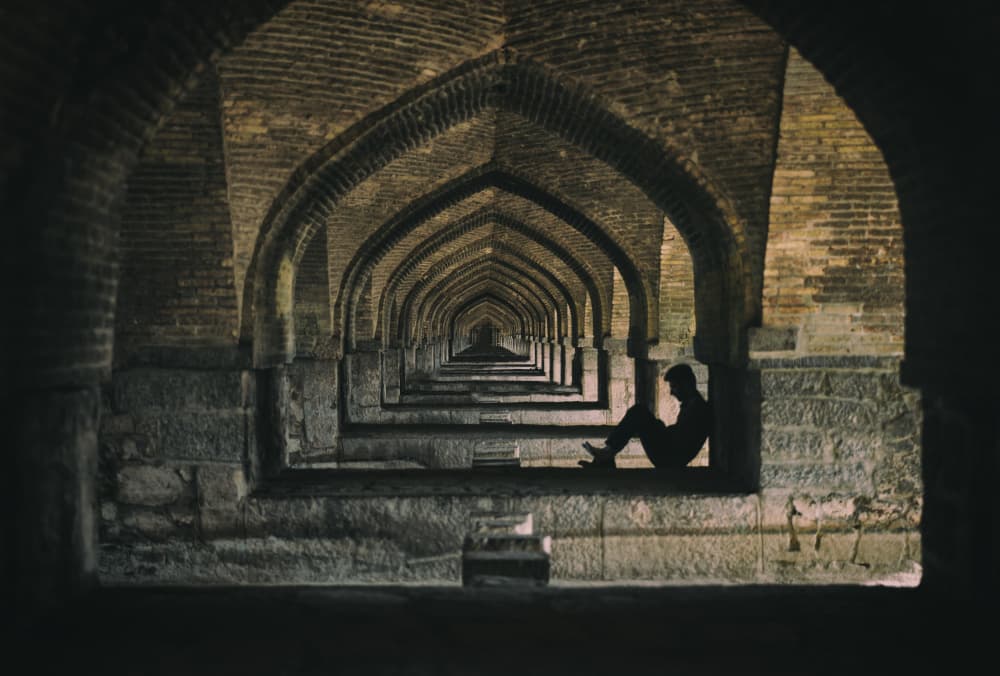 Ancient Arches Lone Figure by Merthan Kortan — canvas wall art