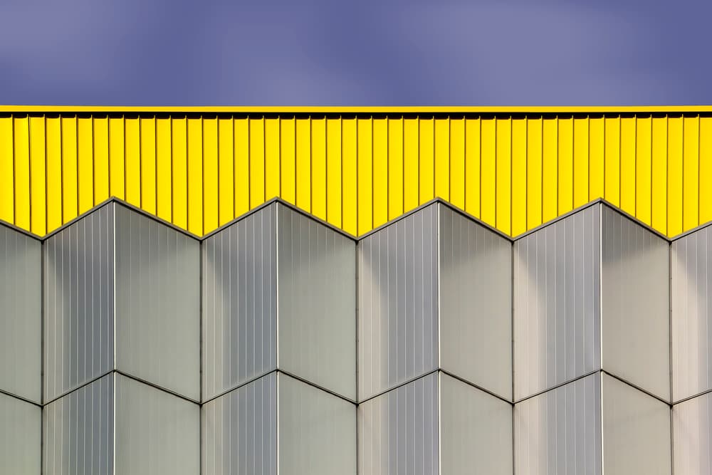 Geometric Yellow Building by Rolf Mauer — canvas wall art