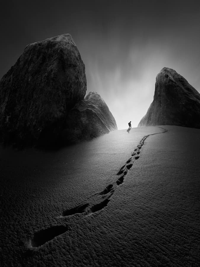 Lone Hiker Snowy Mountains by Tomas Tison — canvas wall art