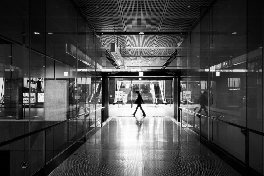 Lone Figure In Modern Hallway by Michiko Ôtomo — canvas wall art