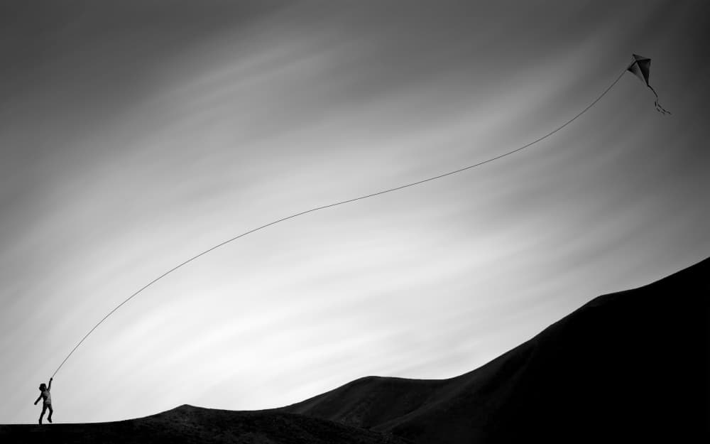 Child Flying Kite by Arastoo Qadermazi — canvas wall art