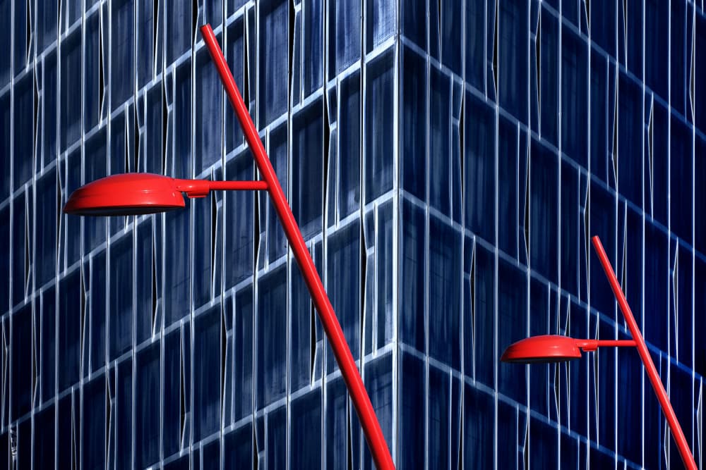 Red Streetlights Blue Building by Hans-Wolfgang Hawerkamp — canvas wall art