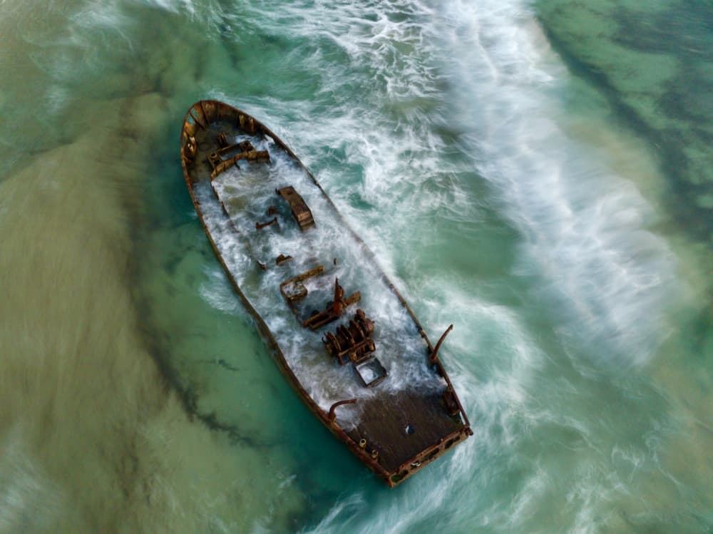 Rusty Shipwreck Coastline by eMunther — canvas wall art
