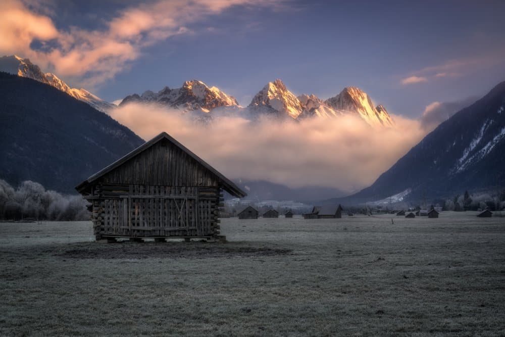 Alpine Cabin Sunrise by Ludwig Riml — canvas wall art