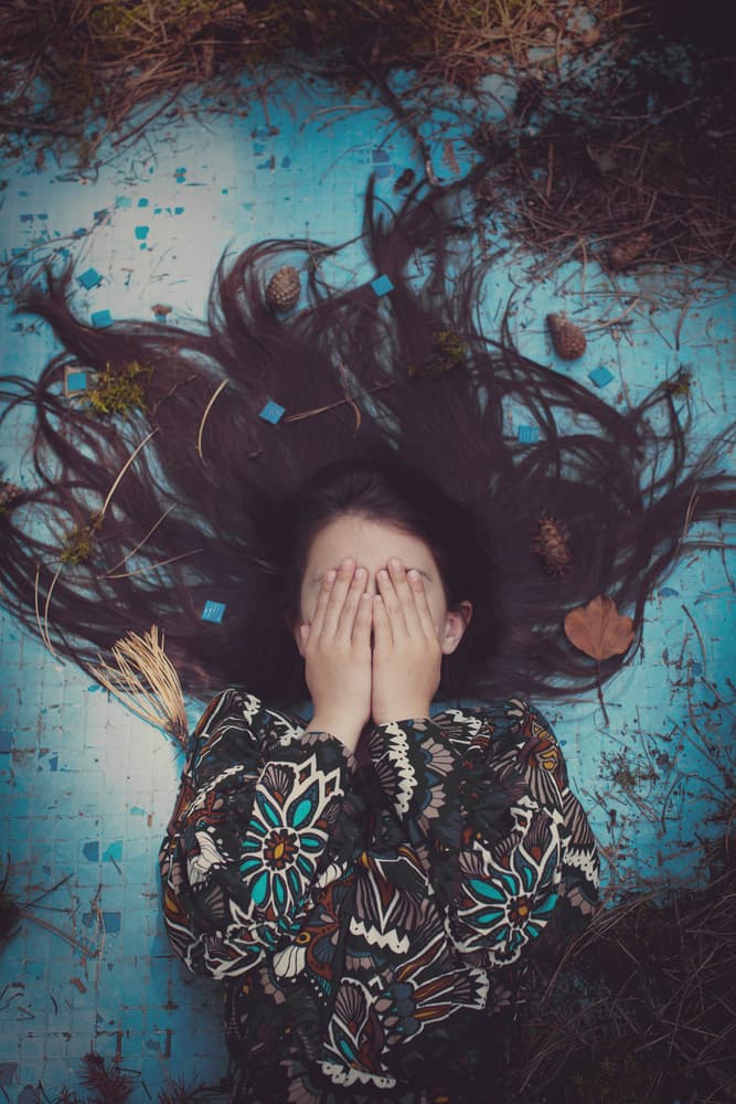 Girl Hiding In Blue by Svetlana Bekyarova — canvas wall art