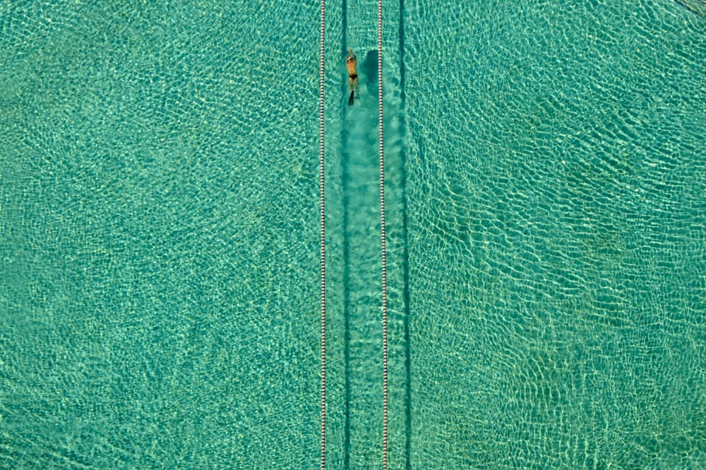 Turquoise Pool Swimmer by Hossein Nikzad Amoli — canvas wall art