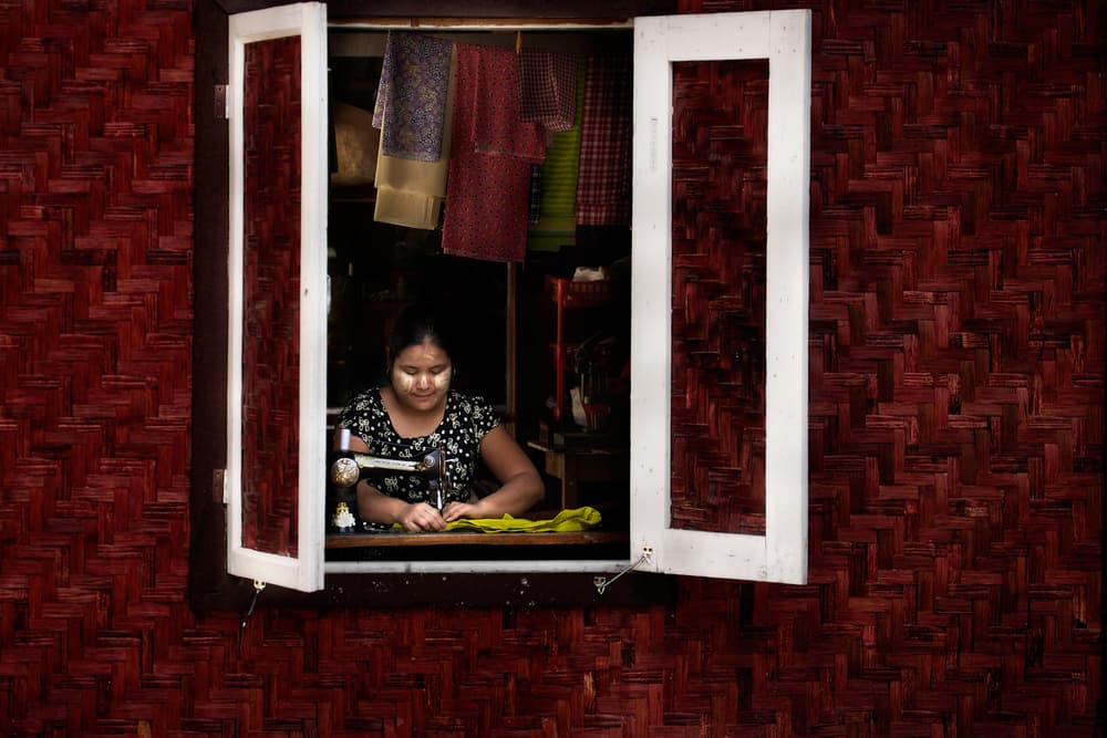 Woman Sewing at Window by txules — canvas wall art