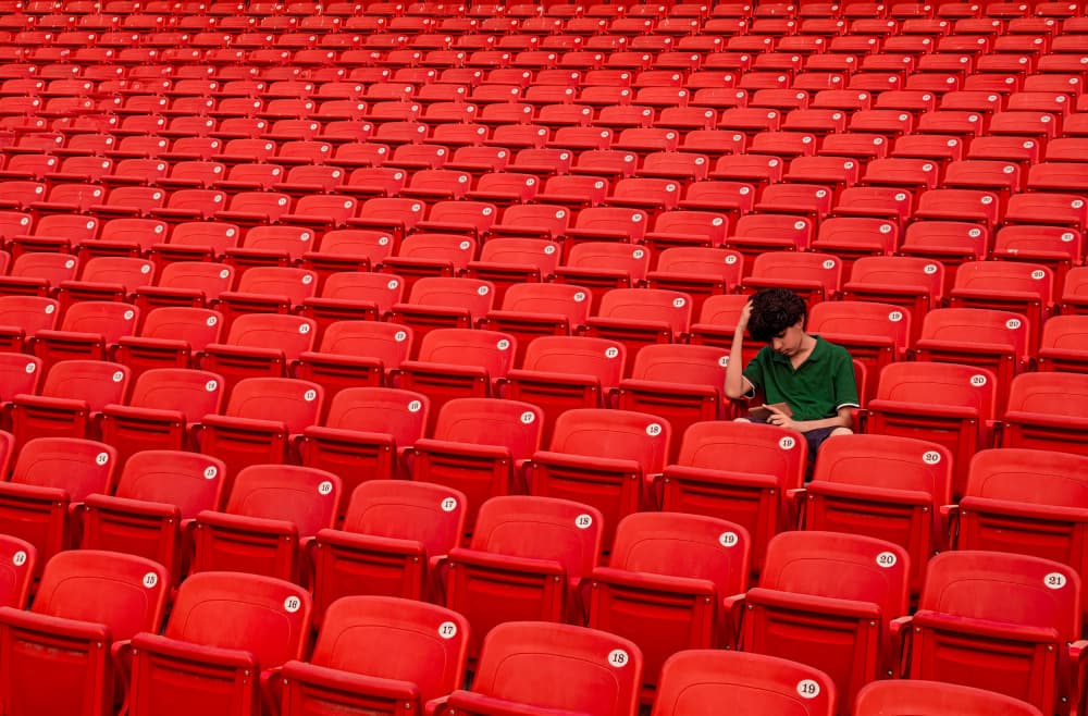 Alone In Red Seats by Sayyed Nayyer Reza — canvas wall art