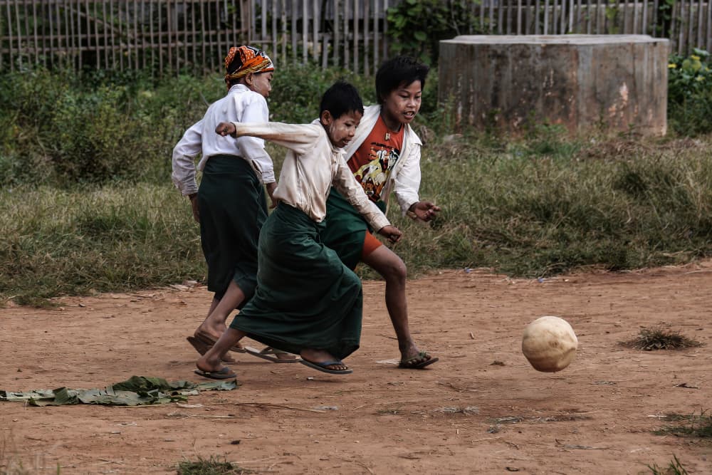 Happy Kids Playing Soccer by Irene Perovich — canvas wall art