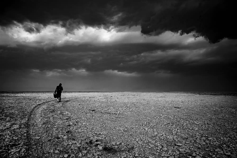 Solitary Walker Stormy Sky by Suleyman Uzumcu — canvas wall art