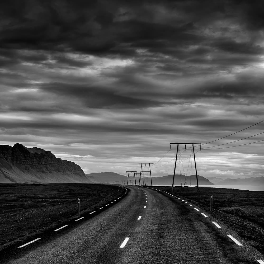 Winding Road Under Dark Clouds by George Digalakis — canvas wall art
