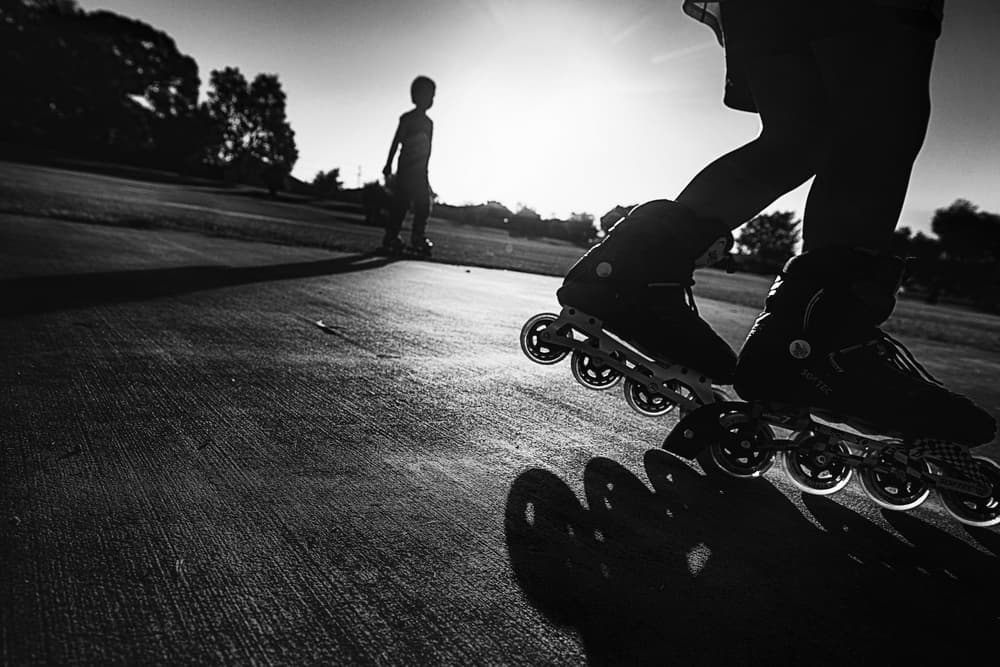 Kids Rollerblading at Sunset by Despird Zhang — canvas wall art