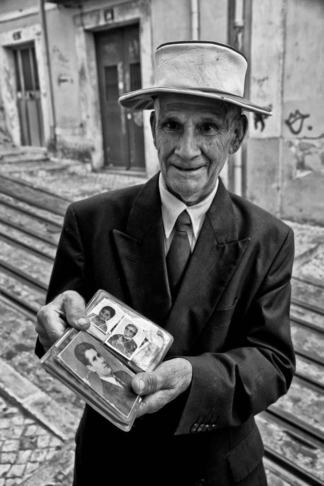 Man with Old Photos by Luis Sarmento — canvas wall art