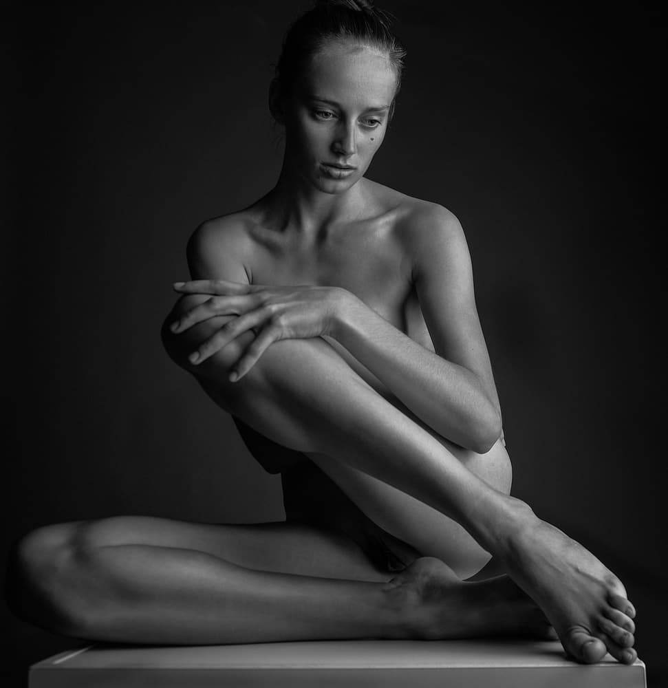 Contemplative Female Figure by AURIMAS VALEVICIUS — canvas wall art