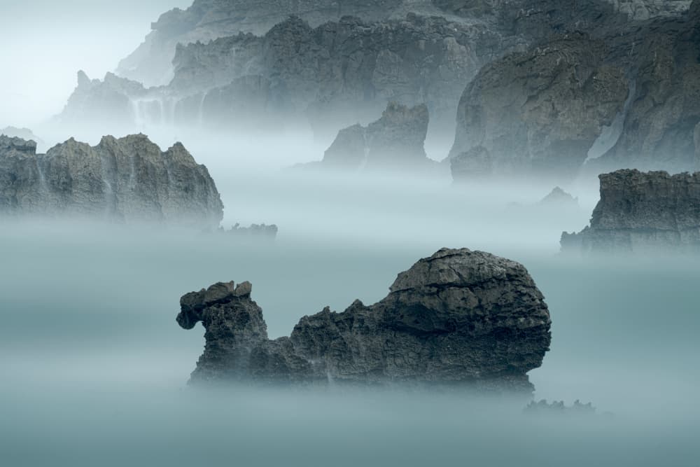 Misty Coastal Rocks by Jesus Concepcion Alvarado — canvas wall art