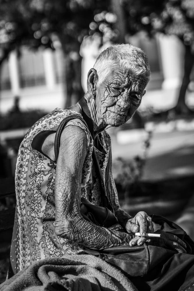 Weathered Face Smoking by Eyal Alcalay — canvas wall art