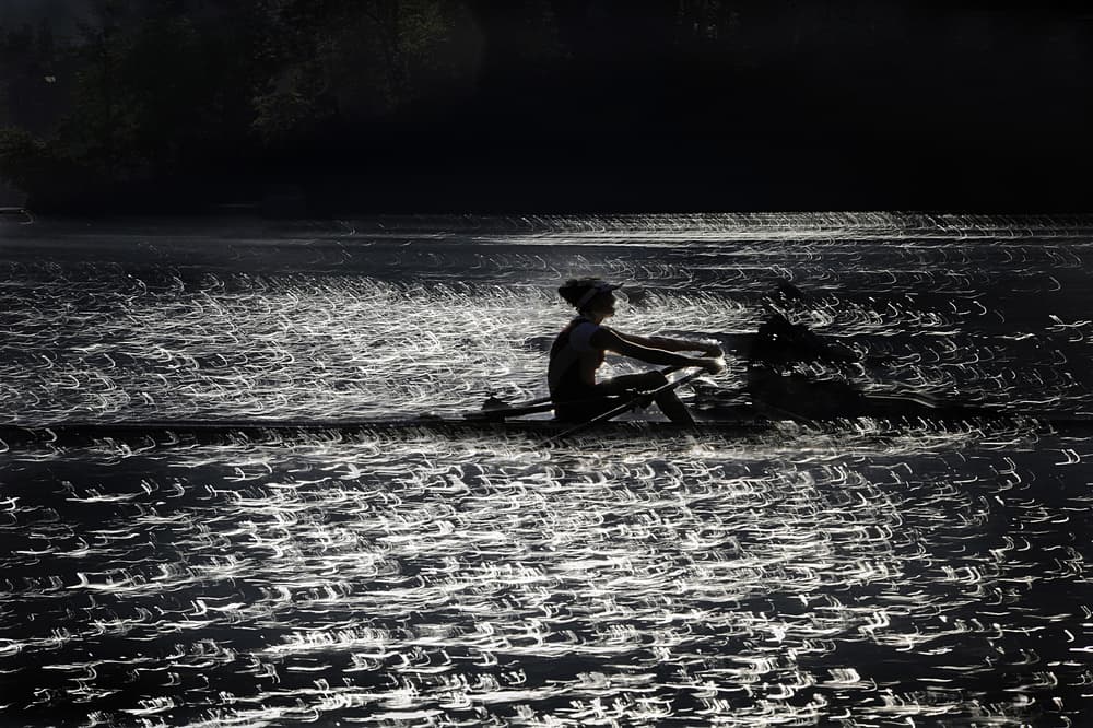 Rower On Shimmering Water by Milan Malovrh — canvas wall art