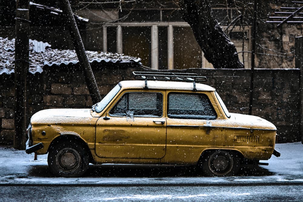 Vintage Car Snowy Street by Vladislav Danilov — canvas wall art