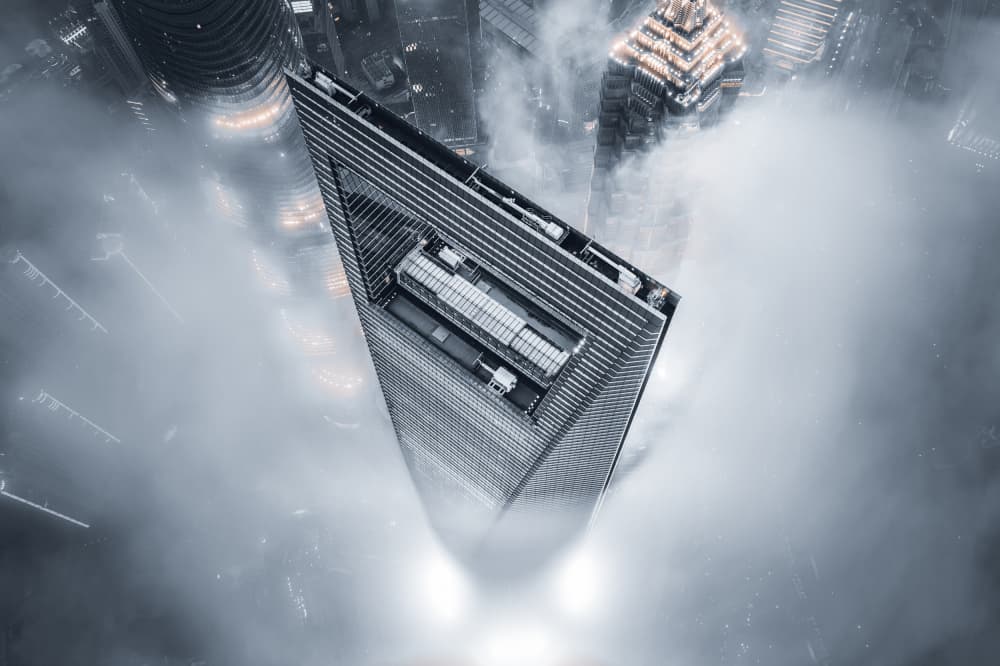 Towering Skyscraper Above Fog by Aron Tien — canvas wall art