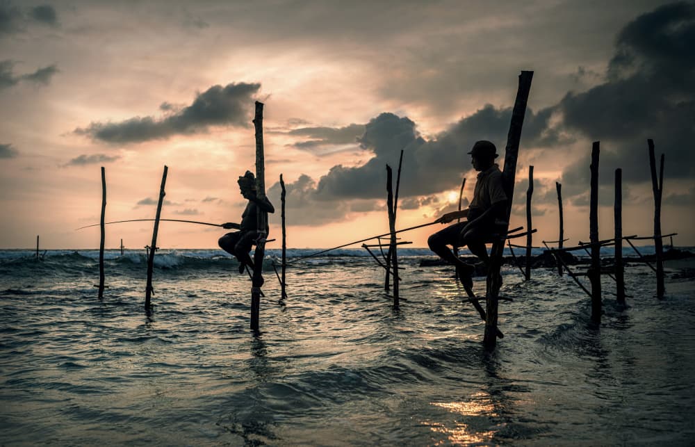 Stilt Fishermen Sunset by Waldemar Szmidt — canvas wall art