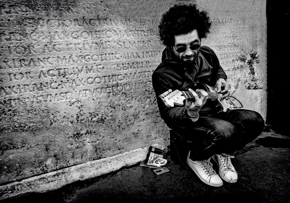 Street Musician Ancient Wall by Ömer Ates Kızıltug — canvas wall art