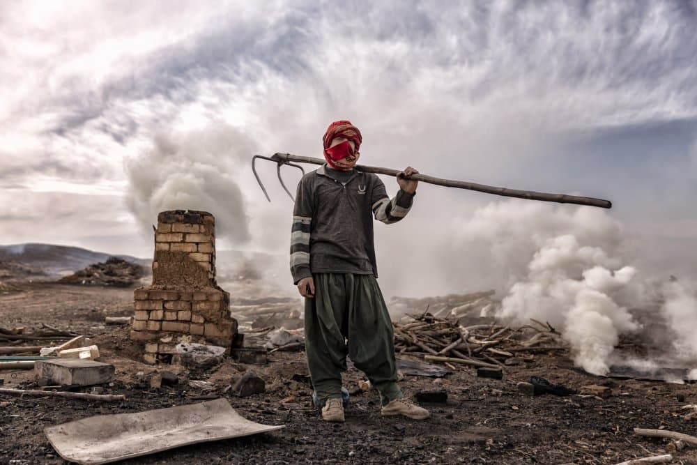 Industrial Worker Amidst Smoke by amir masoud arabshshi — canvas wall art