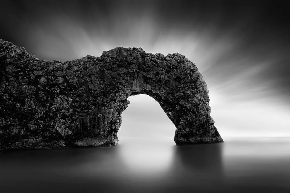Monochrome Sea Arch by George Digalakis — canvas wall art