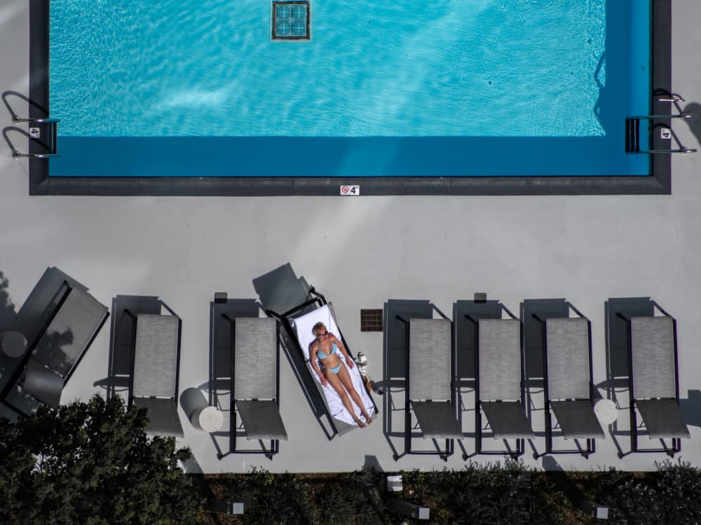 Aerial Poolside Sunbathing by Marek Lapa — canvas wall art