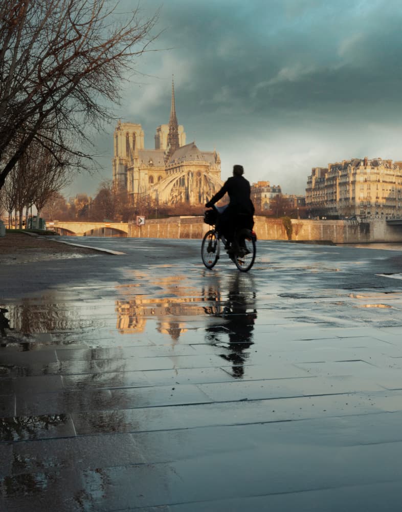 Cyclist Notre Dame Reflection by Gerald Bloch — canvas wall art