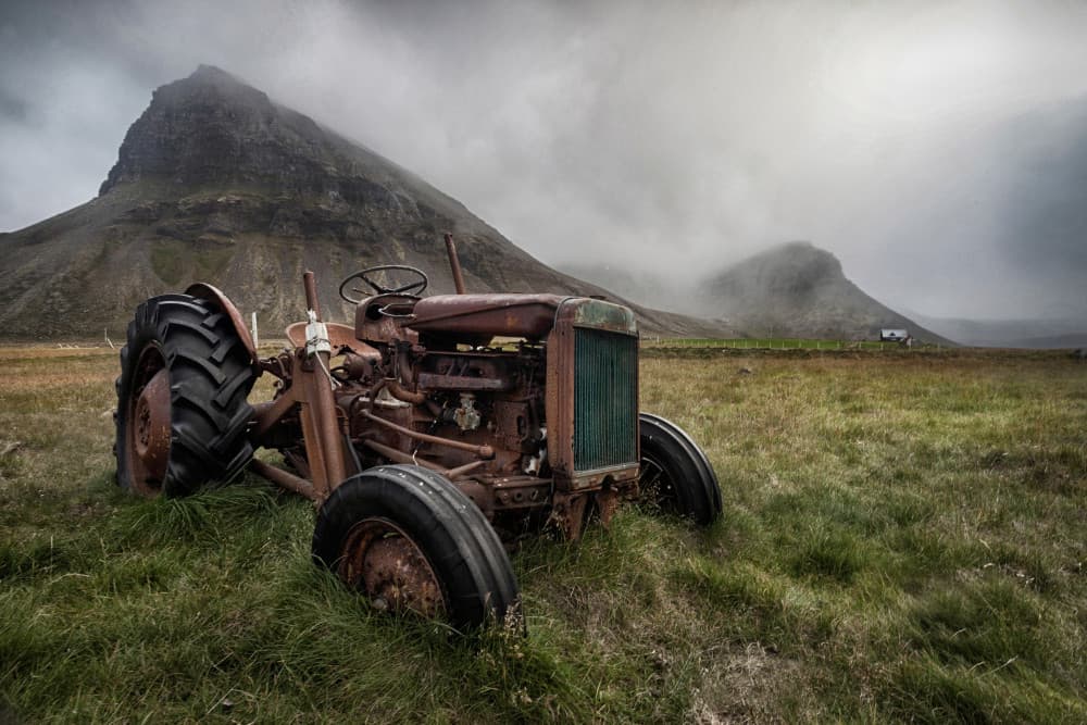 Rusty Tractor Misty Mountains by Þorsteinn H. Ingibergsson — canvas wall art