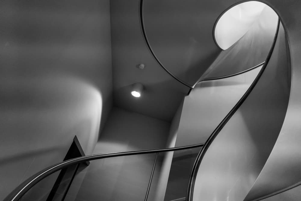 Monochrome Spiral Staircase by Jaap Koer — canvas wall art