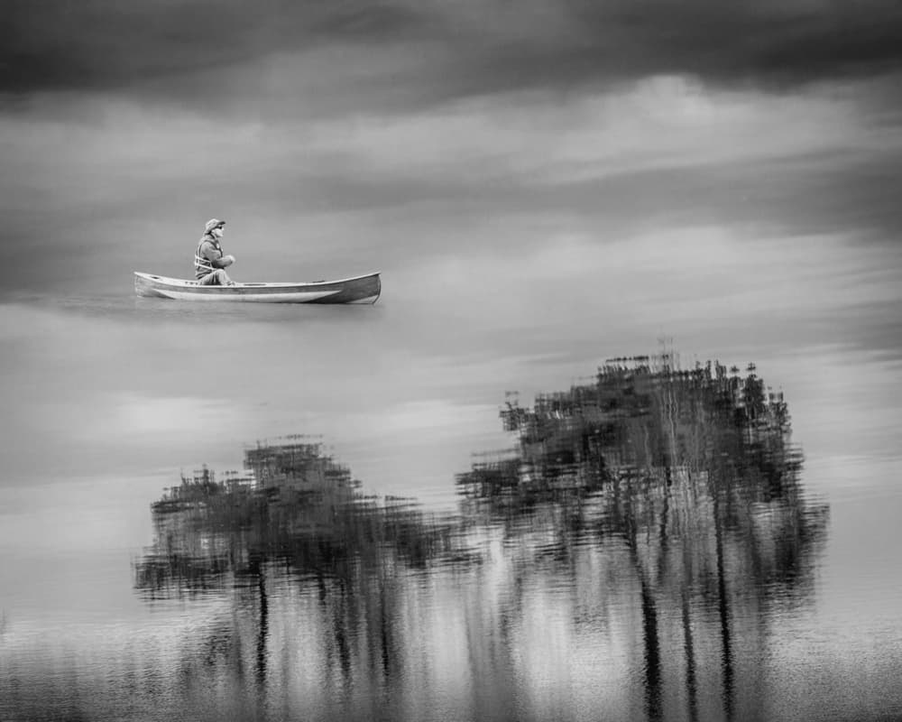 Man in Solitary Canoe by Michelle Degryse — canvas wall art