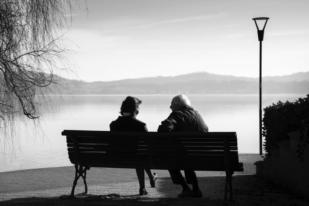 Elderly Couple Lakeside View by Giorgio Toniolo — canvas wall art