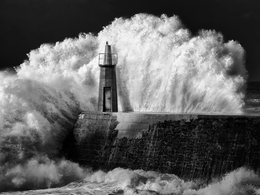 Lighthouse Storm Waves by Alejandro Garcia Bernardo — canvas wall art