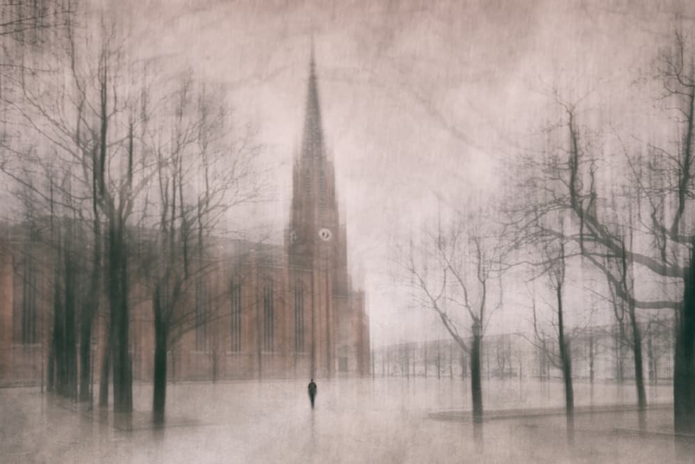 Solitary Figure Winter Church by Roswitha Schleicher-Schwarz — canvas wall art
