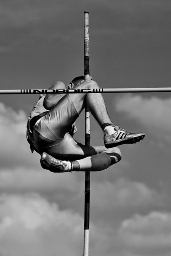 Pole Vaulter Clearing Bar by Jure Kravanja — canvas wall art