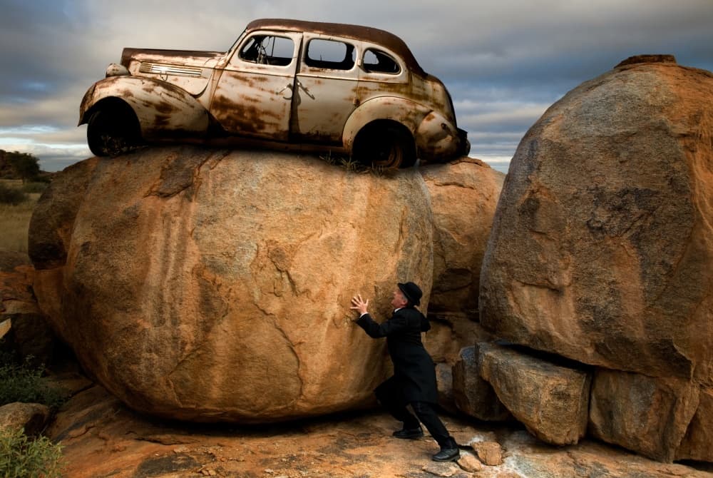 Man Pushing Car Boulder by Christine von Diepenbroek — canvas wall art