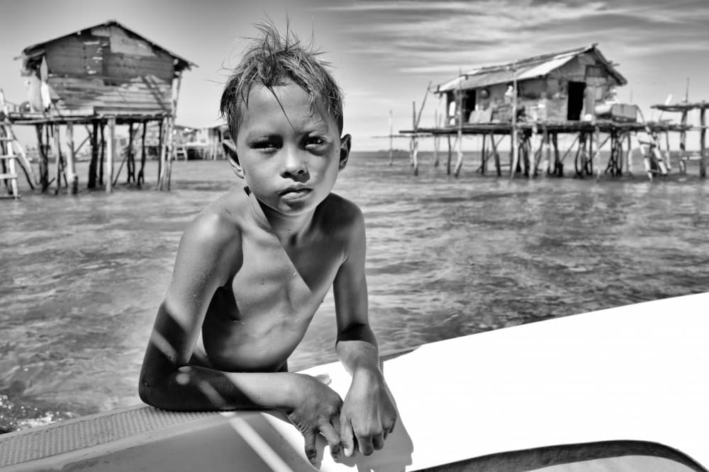 Stilt Village Boy by Kieron Long — canvas wall art