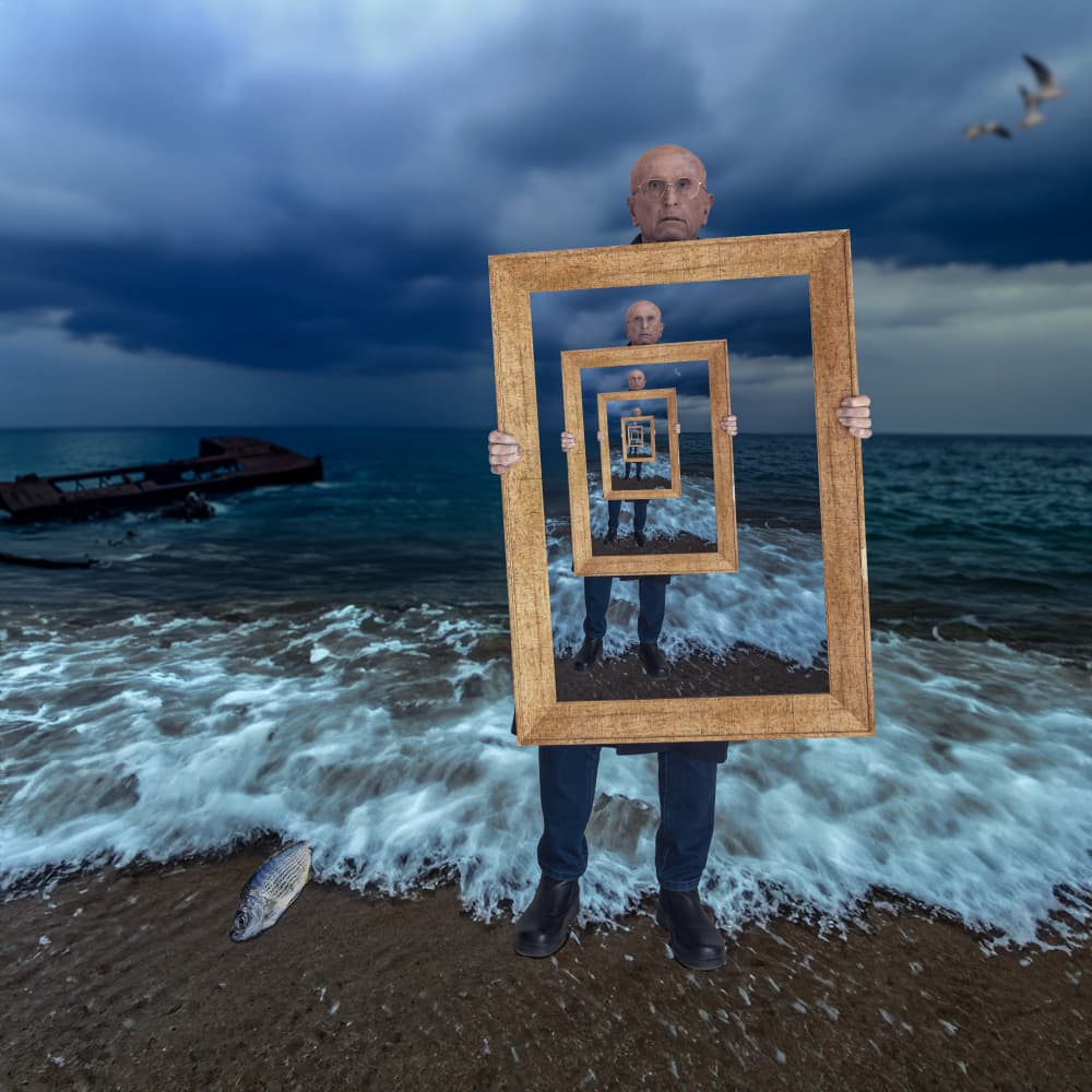 Man Holding Infinite Frames by Dov Fuchs — canvas wall art